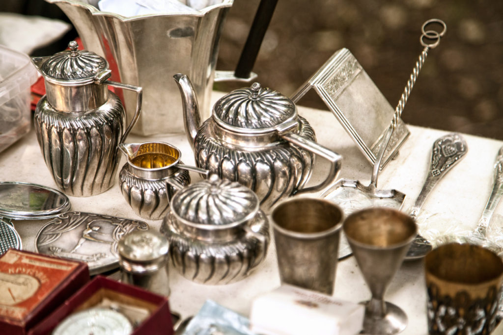 A set of vintage metal tea set and vases