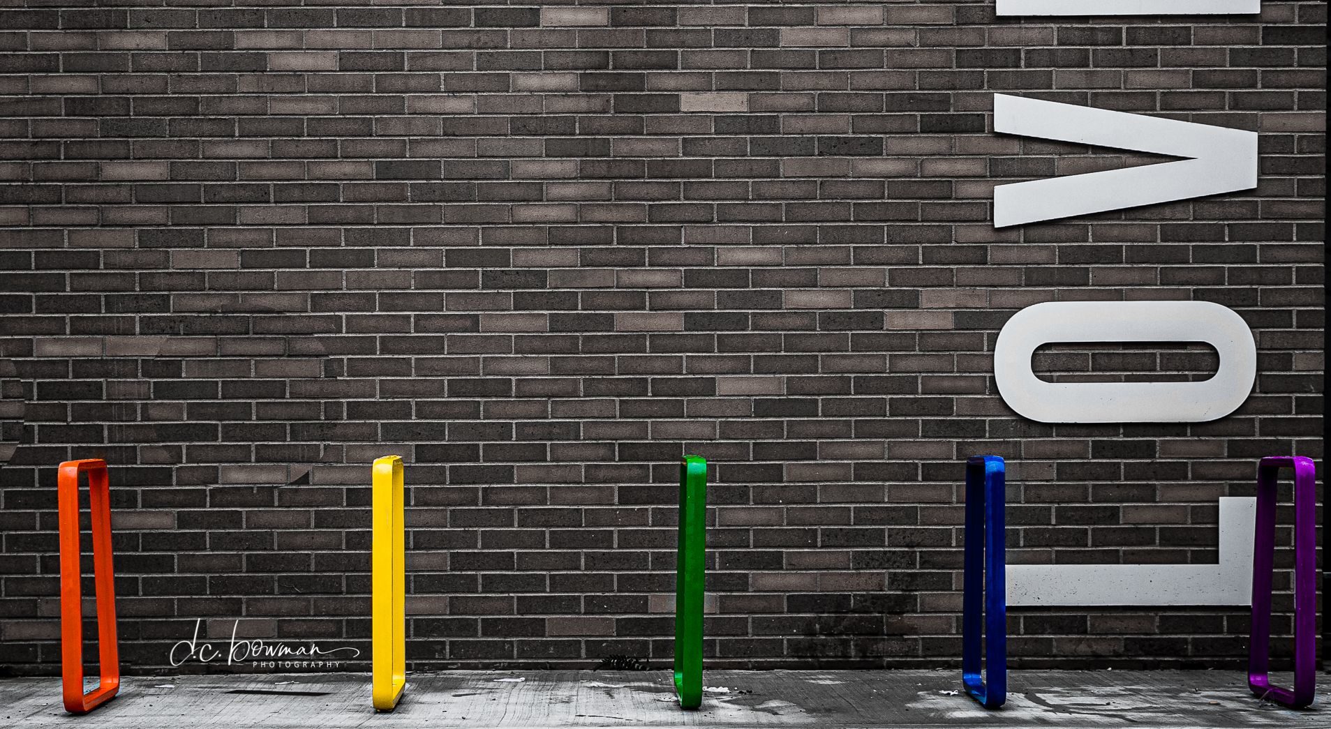 Brightly painted Iconic Bike Racks in front of LOVE wall