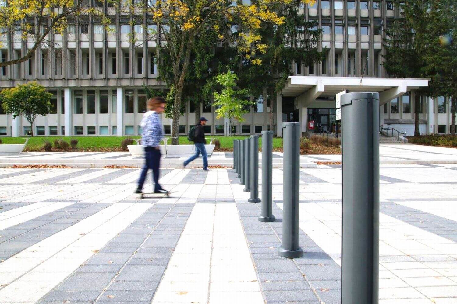 Bollards outside Laval University with man walking