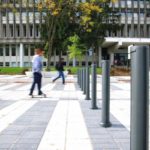 Bollards outside Laval University with man walking