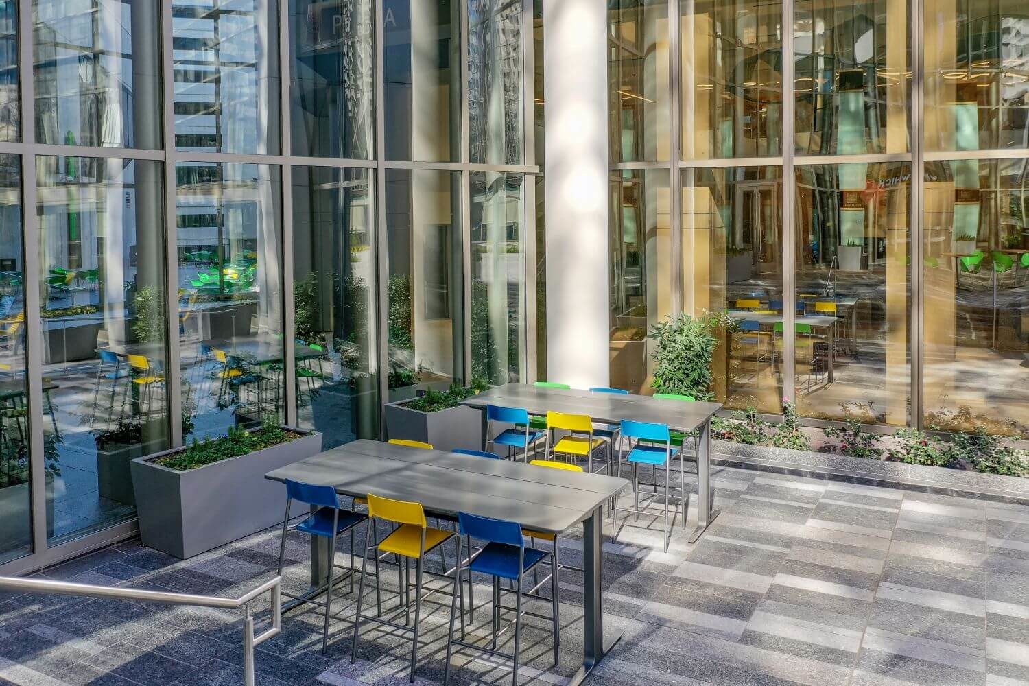 Blue and yellow patio chair at silver patio table