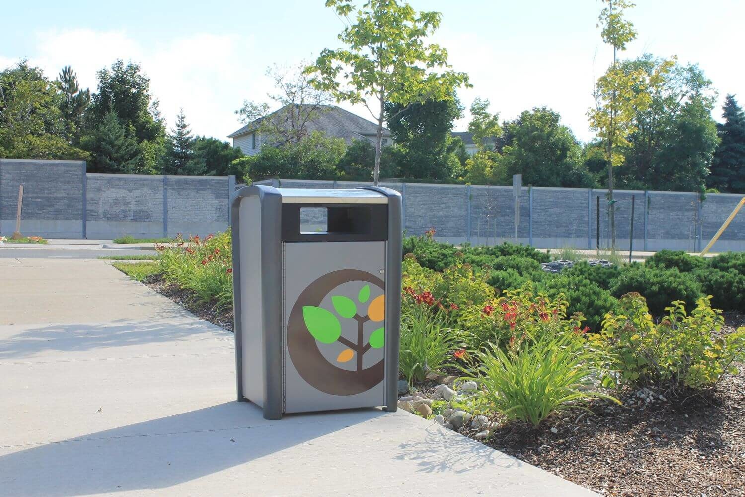 Trash bin outside with gardens