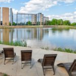 720 wood chaise lounge overlooking pond at Kingsley Town Center