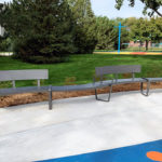 Curvy Lexicon Benches with and without backs in park setting