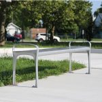 870 Backless Metal Bench in park setting