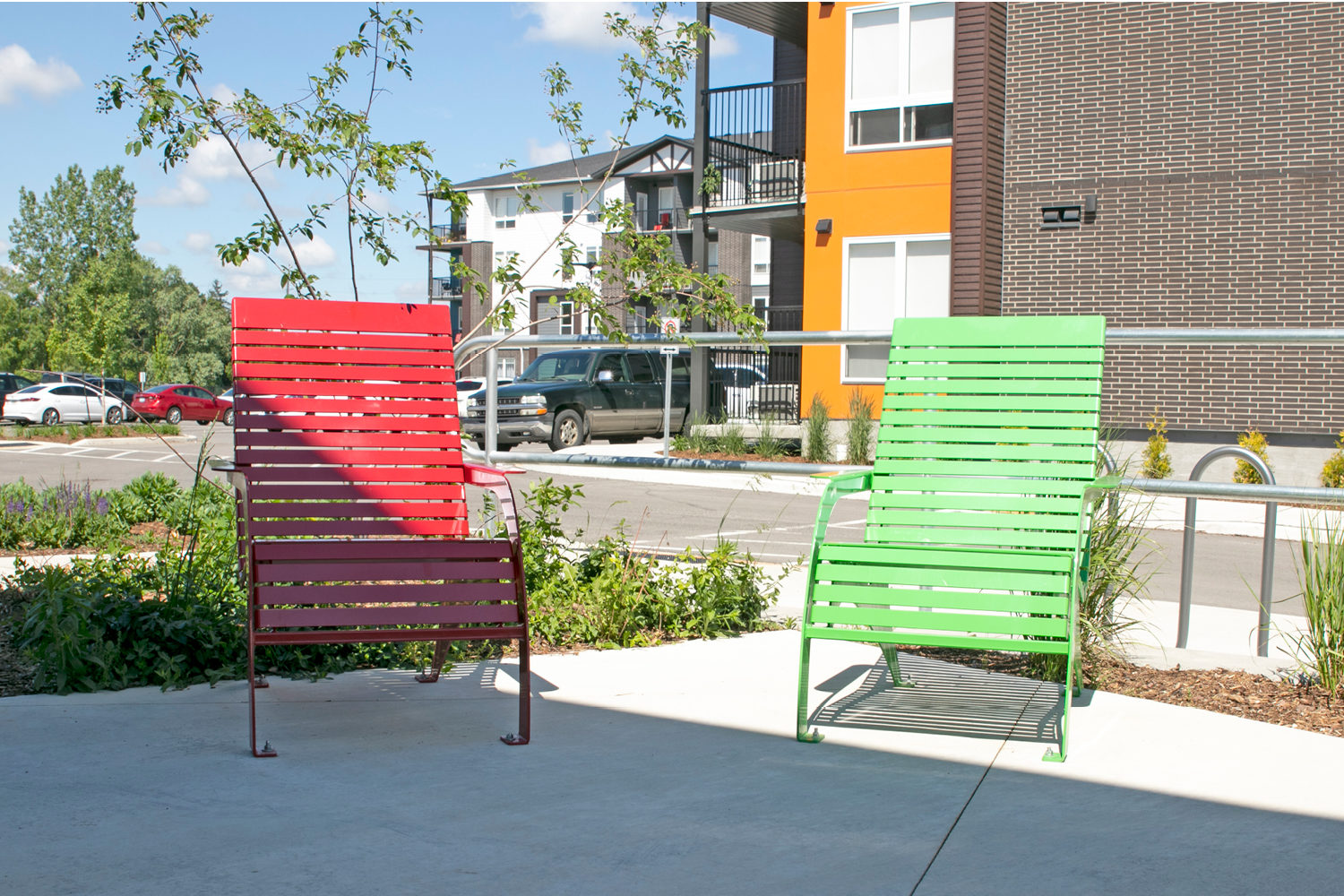 Red and Green powdercoated 720 chairs at apartment complex