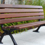 Backed Wood Bench Outside Building