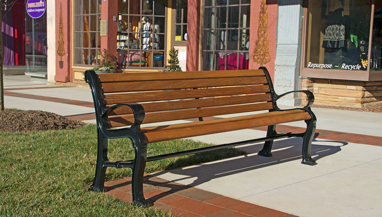 Wood and Metal Backed Bench Near Commercial Shops