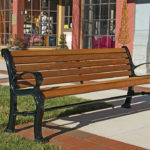 Wood and Metal Backed Bench Near Commercial Shops