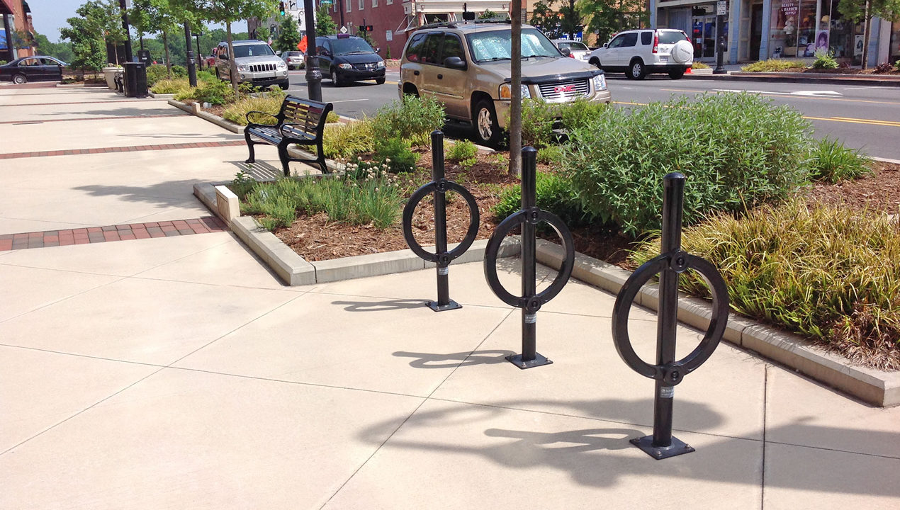 Three surface mount bike racks in black