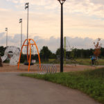 Silver Loop Bike Racks at a children's playground