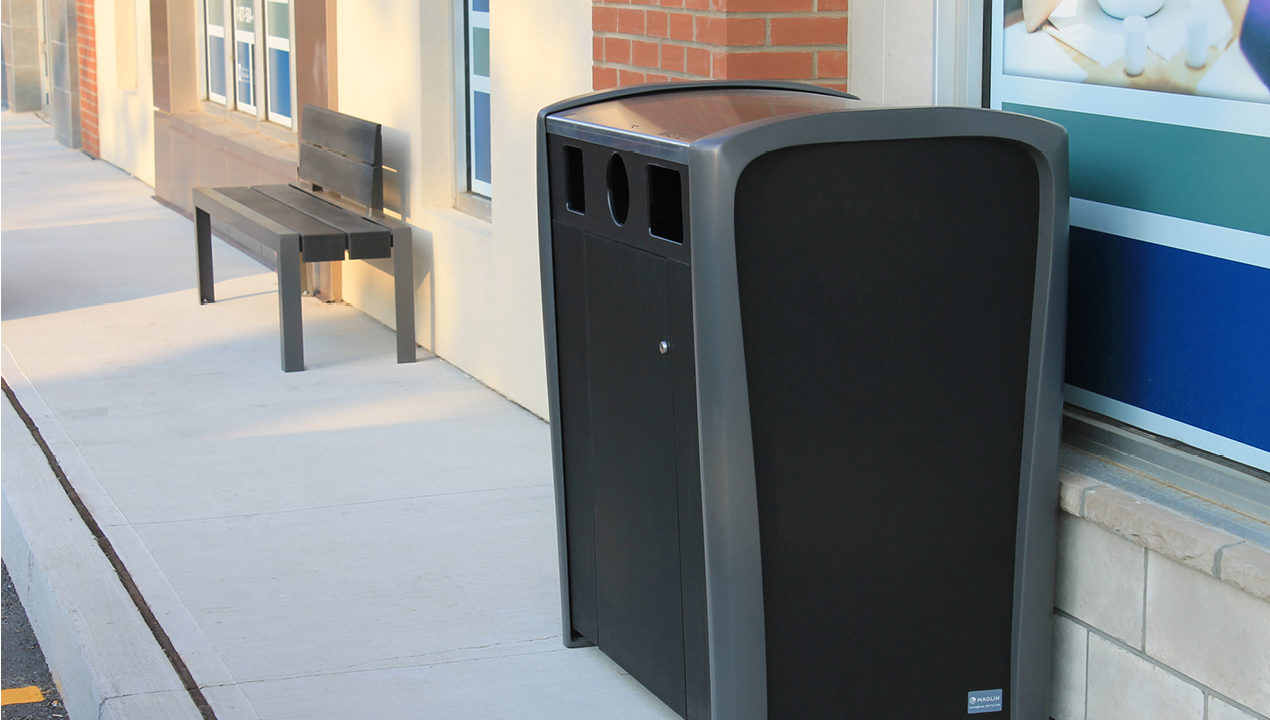 Black and Grey Trash Can Outside Building