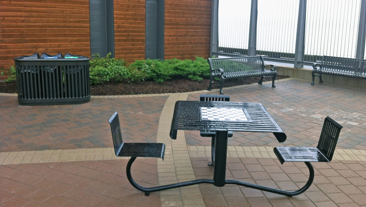 Black WheelChair Accessible Table with Chess Board inside Building