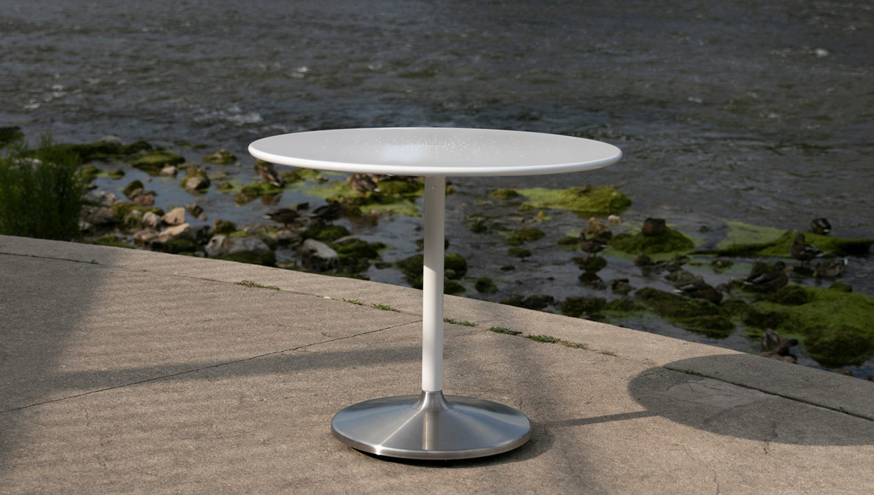 White Circular Cafe Table Near River