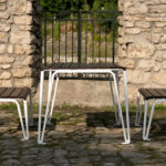 2300 Series Iconic Table and Benches Near Stone Fence