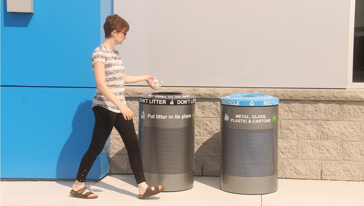 Woman throwing out trash in proper bin