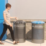 Woman throwing out trash in proper bin