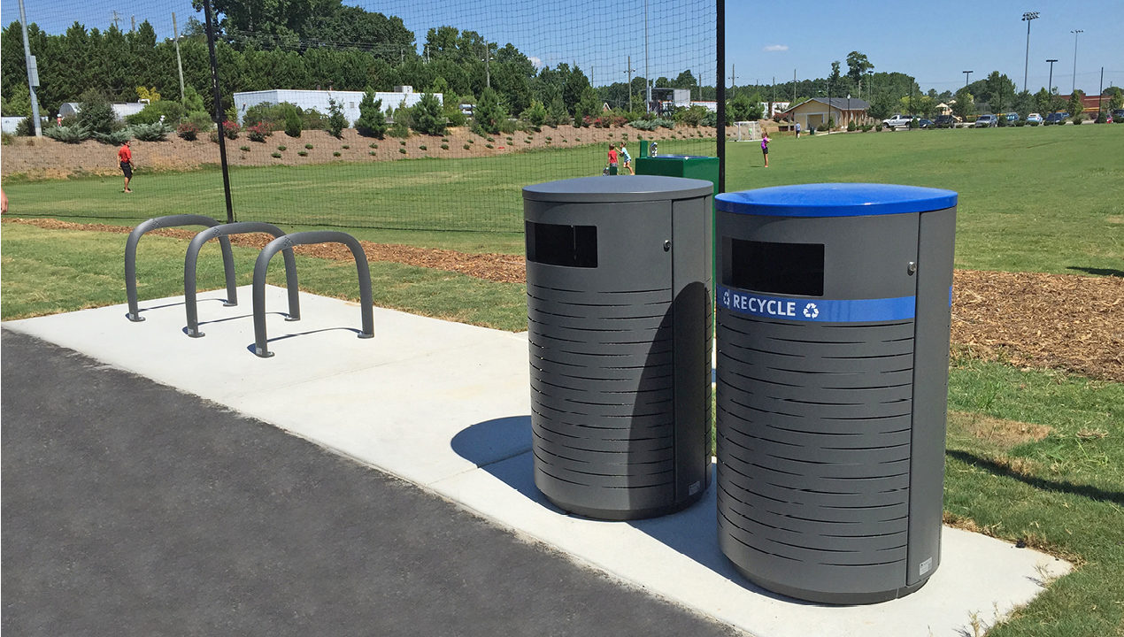 Birch pattern 650 recycle and trash containers at a park
