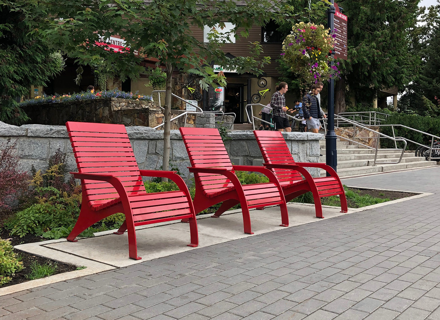 Three red 720 Whistler Chairs