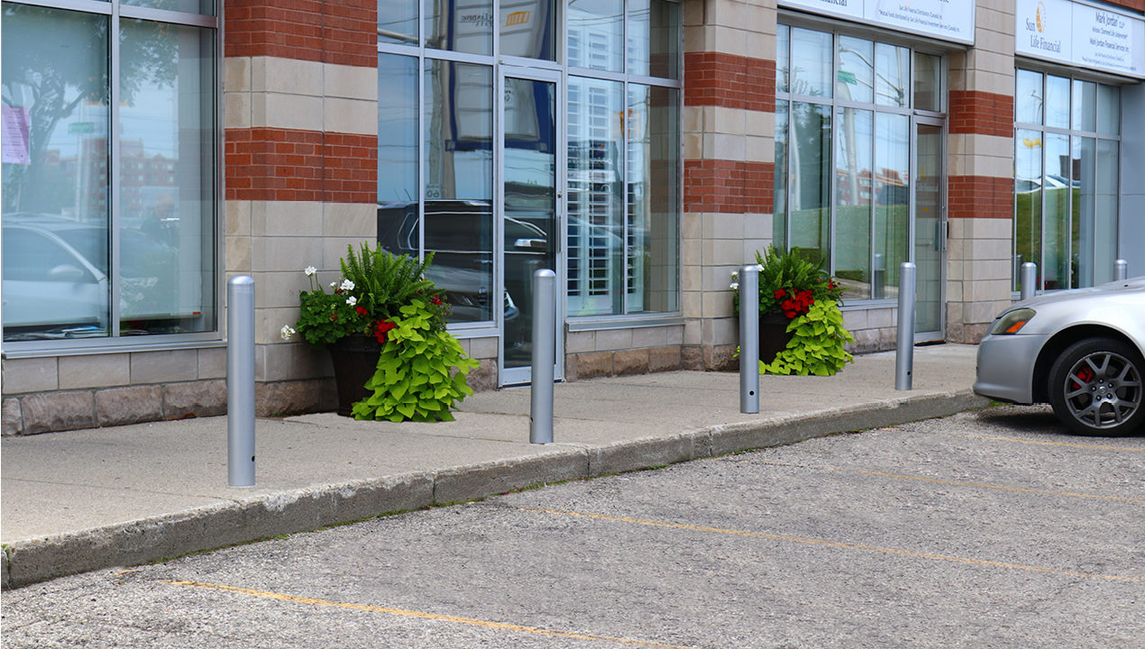 500 Series Bollards painted silver in front of office building