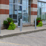 500 Series Bollards painted silver in front of office building