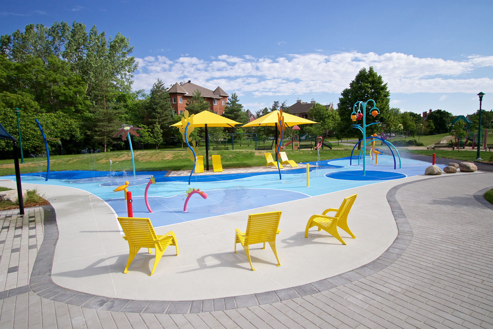 Yellow 720 Chairs surrounding splash pad