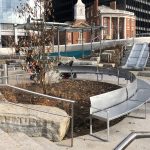 Custom curved steel perforated bench in the Battery Playscape