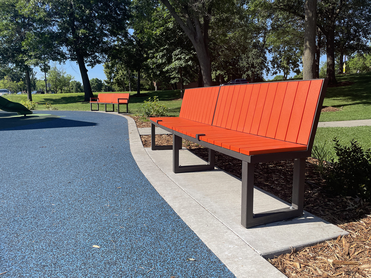 Backed Ogden Benches, HDPE Orange at shoreview commons park