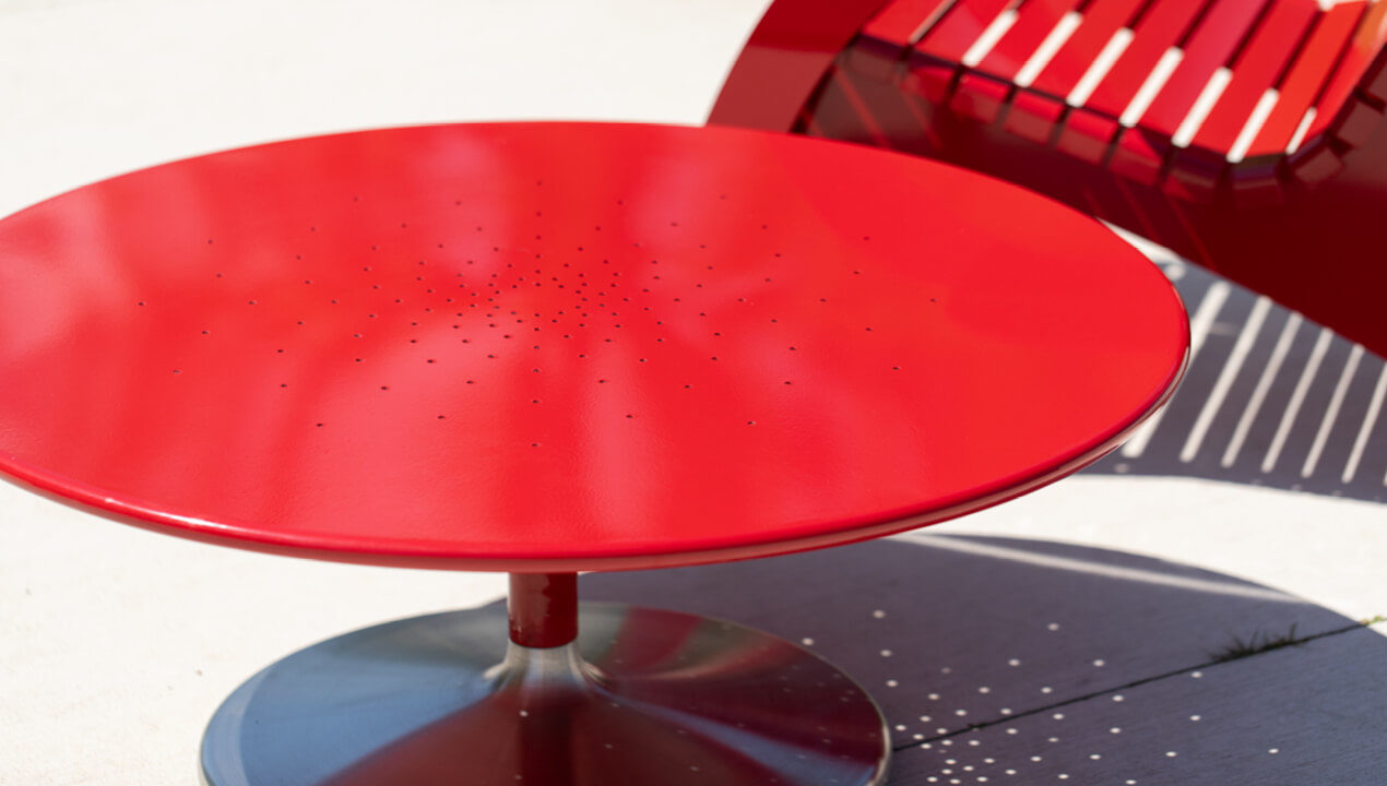 Close-up of Battery 36in lounge table in powdercoat red