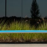 970 Backless Bench with High Density Polyethylene Seat in Blue with grasses in background