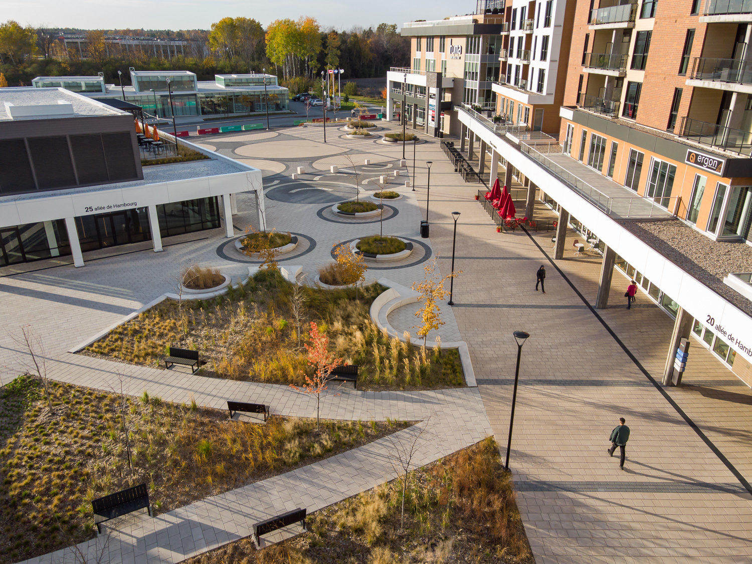 agora-overhead-day-pathways-greenspace-ogden-benches Over head view of the green space at AGORA Plaza in autumn. The image shows the pathways lined by comfortable Ogden benches.