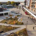 Over head view of the green space at AGORA Plaza in autumn. The image shows the pathways lined by comfortable Ogden benches.