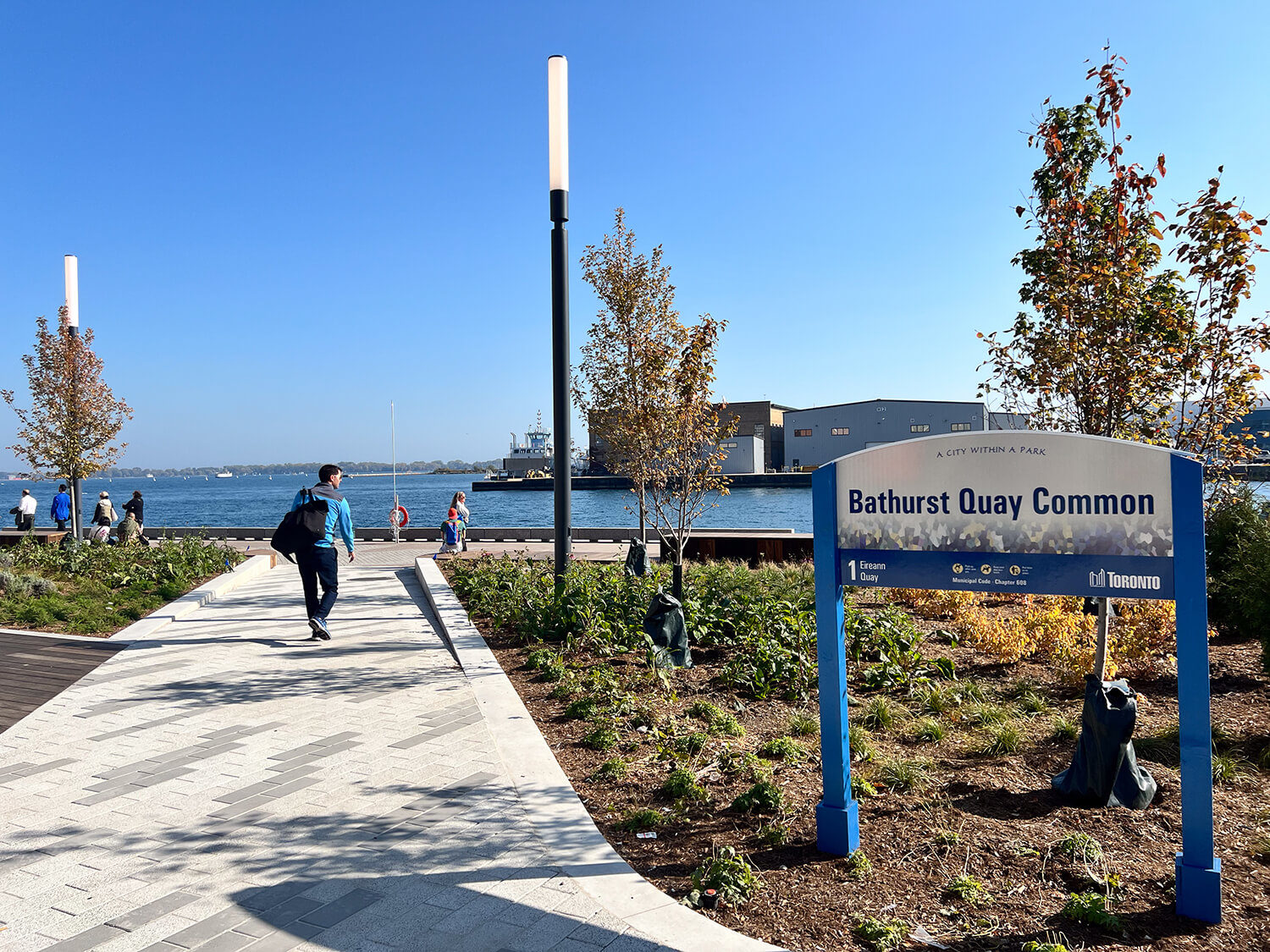 maglin_bathurst-quay-sign Bathurst Quay Common sign at entrance to the waterfront park with person walking towards the water