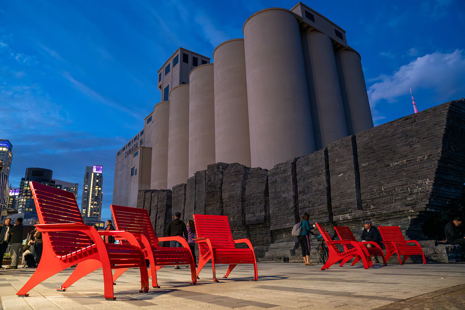 maglin_bathurst-quay_720-chairs_5 Maglin 720 Chairs brightly lit up against beautiful dark blue sky and silos at Bathurst Quay Commons