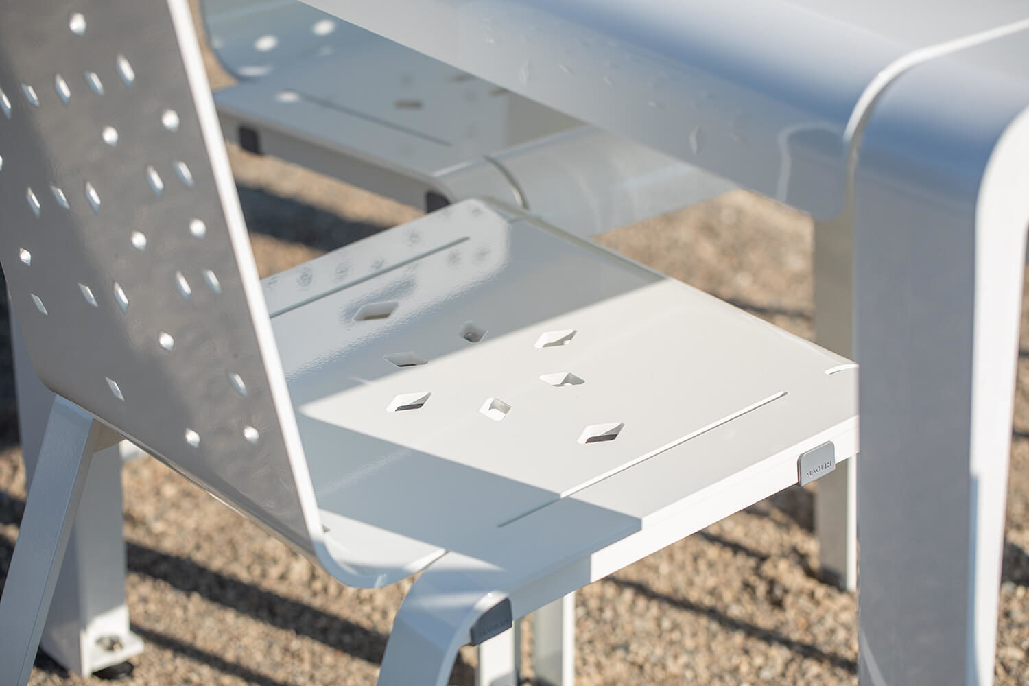 Close-up image of ALUM table and chair pattern detail, powdercoated white gloss