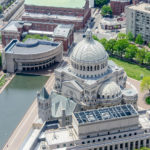 Christian Science Plaza overhead view of building with lush trees and water feature