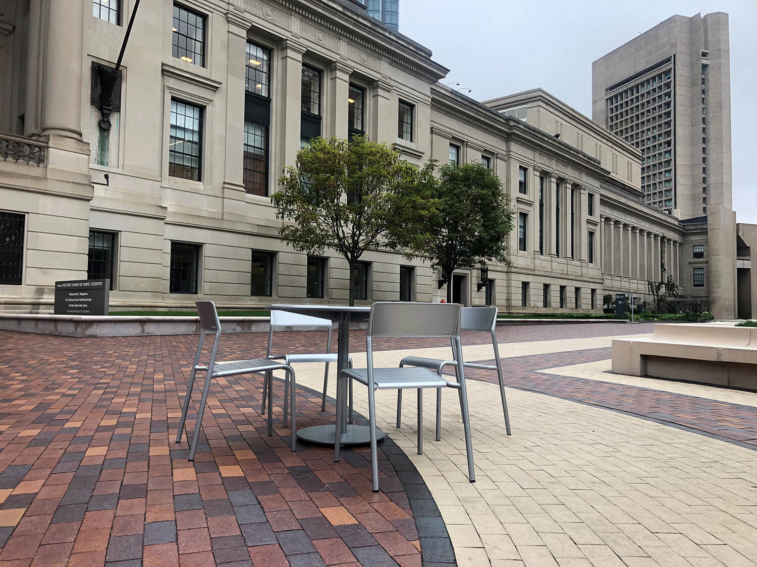 Foro table and chairis next to Christian Sciene Plaza