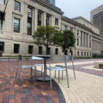 Foro table and chairis next to Christian Sciene Plaza