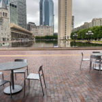 Maglin Foro tables and seating in front of water feature at Christian Science Plaza