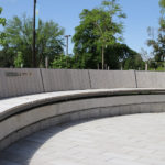 Curved Ogden wall mount bench at University of Guelph Lang Plaza