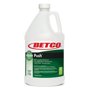 A one-gallon bottle of BETCO GREEN EARTH PUSH Liquid Bacteria, Digester, and Spotter multi-purpose cleaner and odor eliminator. The label is white and green with product information and certifications. The bottle has a handle and a white cap.