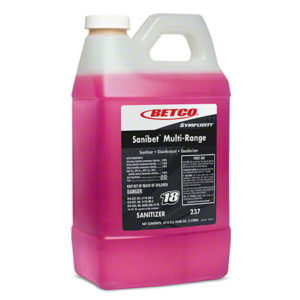 A plastic container of BETCO FASTDRAW #18 SANIBET MULTI-RANGE SANITIZER, Disinfectant, and Deodorizer, with a pink liquid inside and safety instructions on the label.