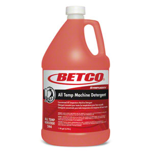 A red gallon container of BETCO SYMPLICITY ALL TEMP MACHINE DETERGENT 115, labeled with product information.