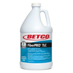 A gallon-size jug of Betco FiberPRO Traffic Lane Cleaner carpet prespray. The label features product details and the Betco logo.