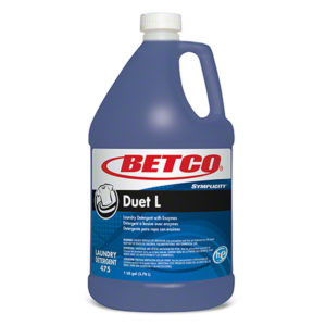 A gallon container of BETCO Simplicity Duet-L laundry detergent with enzymes, labeled "475," featuring a white cap and a handle for easy pouring.