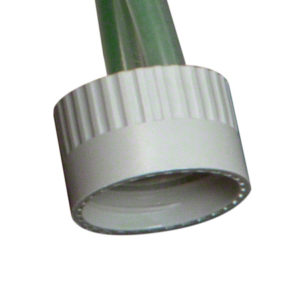 Close-up image of a FASTDRAW CAP (#67.36.4), a white, ribbed plastic cap attached to a green bottle or tube.