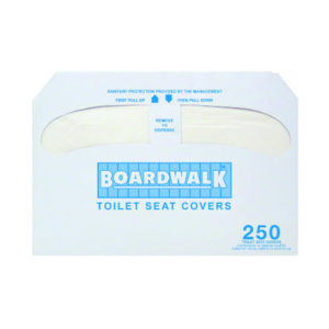 Image of a white box labeled "HG2500 Toilet Seat Covers." The box contains 2,500 half-fold toilet seat covers and has instructions in blue text for pulling out the covers to dispense them.