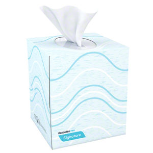 A light blue box of F710 SIGNATURE 2 ply BOUTIQUE FACIAL TISSUE with a wavy design, dispensing a single white tissue. The box is labeled "Cascades PRO Signature.