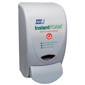 Wall-mounted dispenser labeled "SAN1LDS DISP 1 LITER SANITIZER WHITE CURVE" with instructions for use.