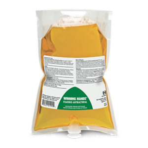 A sealed, clear plastic bag filled with a yellow liquid, labeled "BETCO CLARIO Foaming Antibacterial Hand Soap", displaying a printed label with text and a barcode.